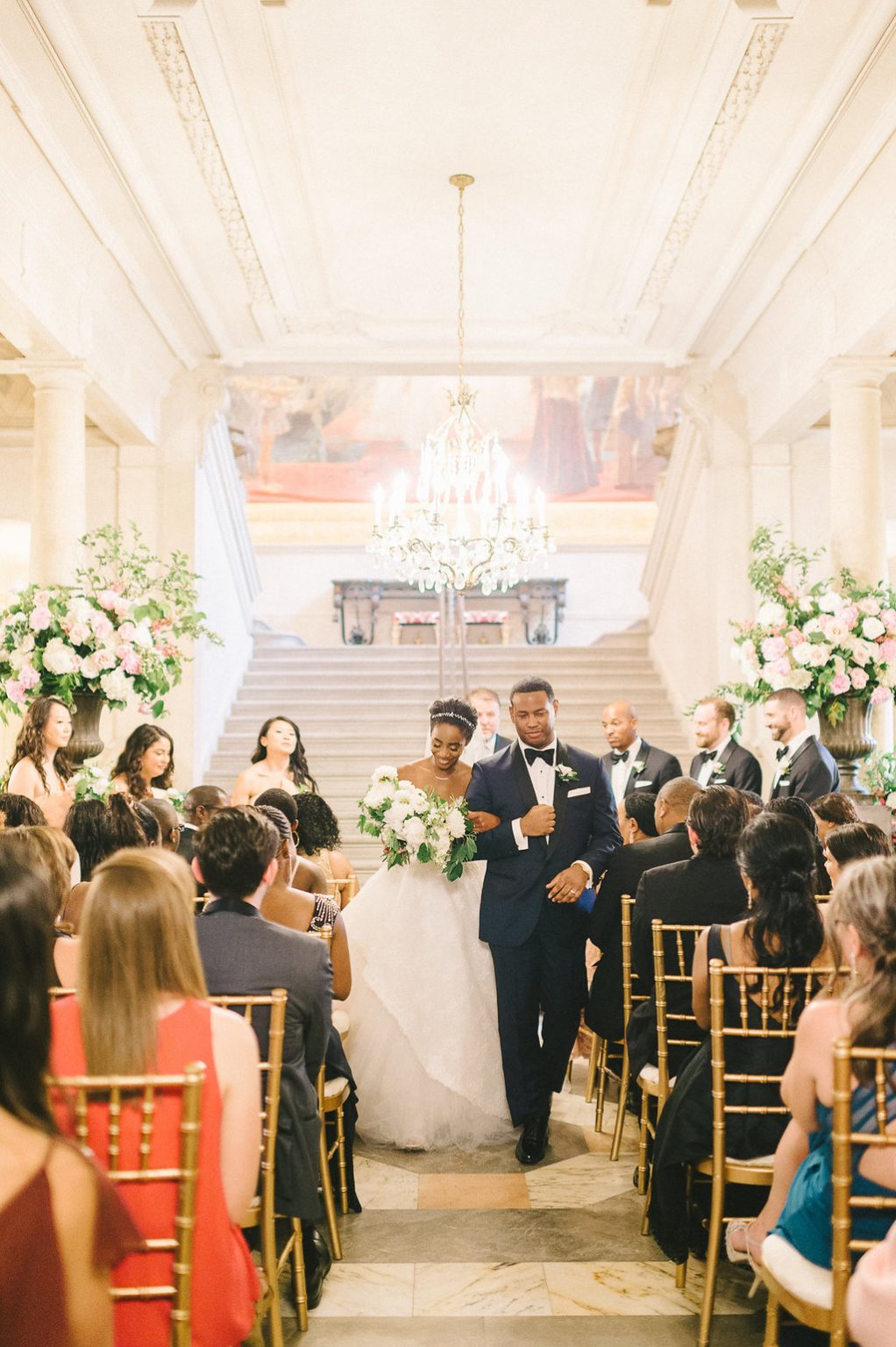 <h2>Gliding through guests in the Great Stair Hall</h2>Photo by Elizabeth Fogarty. Cristina Calvert, planner.