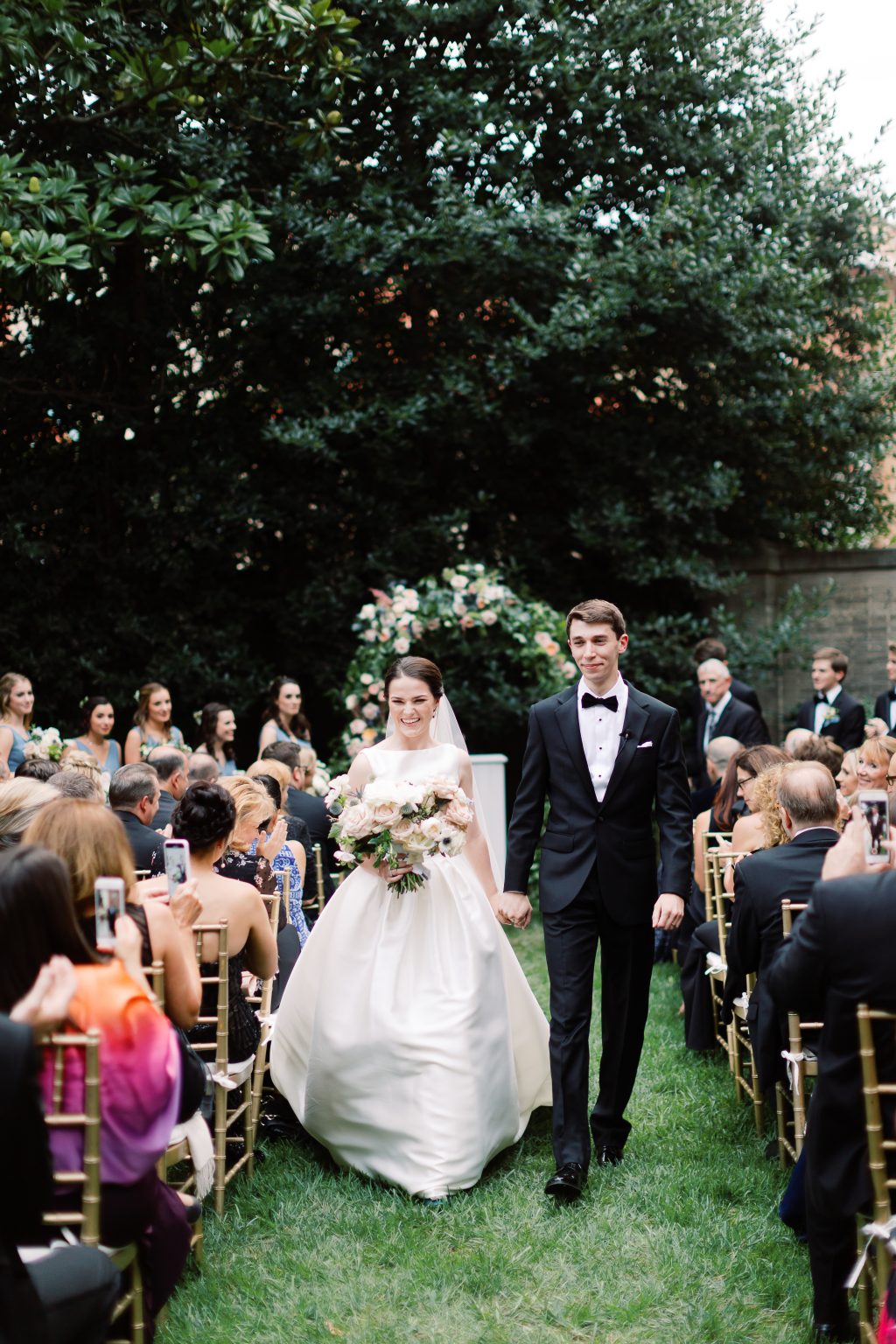 <h2>A trellis ceremony under the holly and magnolia</h2>Photo by Sarah Bradshaw. Aimee Griffin, planner.