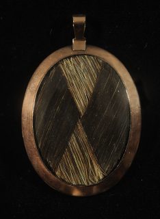 Back side of an oval portrait miniature of William Henry Bruce with woven hair
