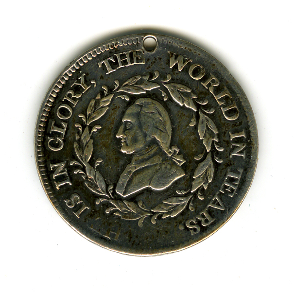 Circular silver coin with a profile bust of George Washington surrounded by an inscription