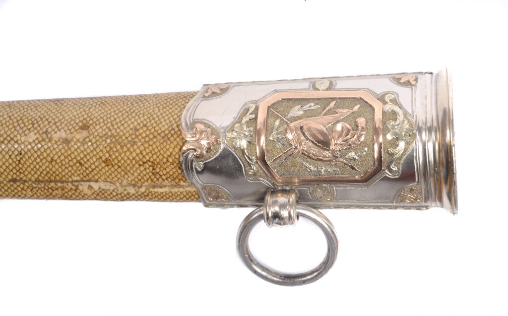 Detail of the silver mount at the opening of a shagreen scabbard