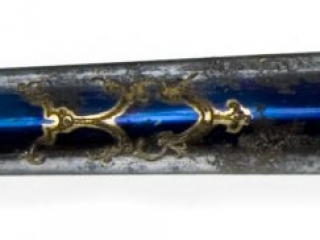 Detail of a niter blued steel blade of a presentation sword