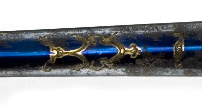 Detail of a niter blued steel blade of a presentation sword