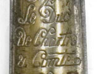 Click for a larger view. Engraved maker's mark on a gold panel of a presentation sword