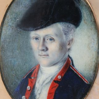 Detail of an vval watercolor portrait miniature of William Truman Stoddert wearing a military uniform, in a gold case, after conservation treatment