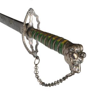 Green-stained and silver sword hilt at an angle