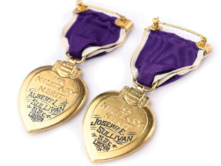 Click for a larger view. Reverse of two Purple Heart medals engraved with the names of the recipients, Albert L. and Joseph E. Sullivan