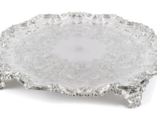 Click for a larger view. Ornate circular silver tray with feet